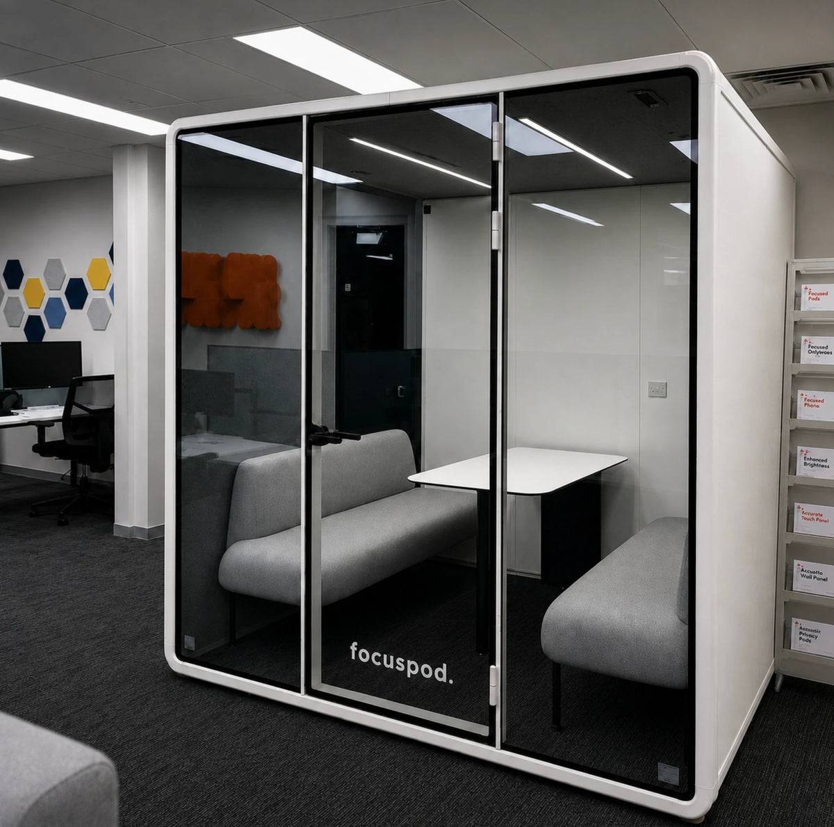White FocusPod Meet with grey upholstered seating and a shared table in an open-plan Brisbane office.